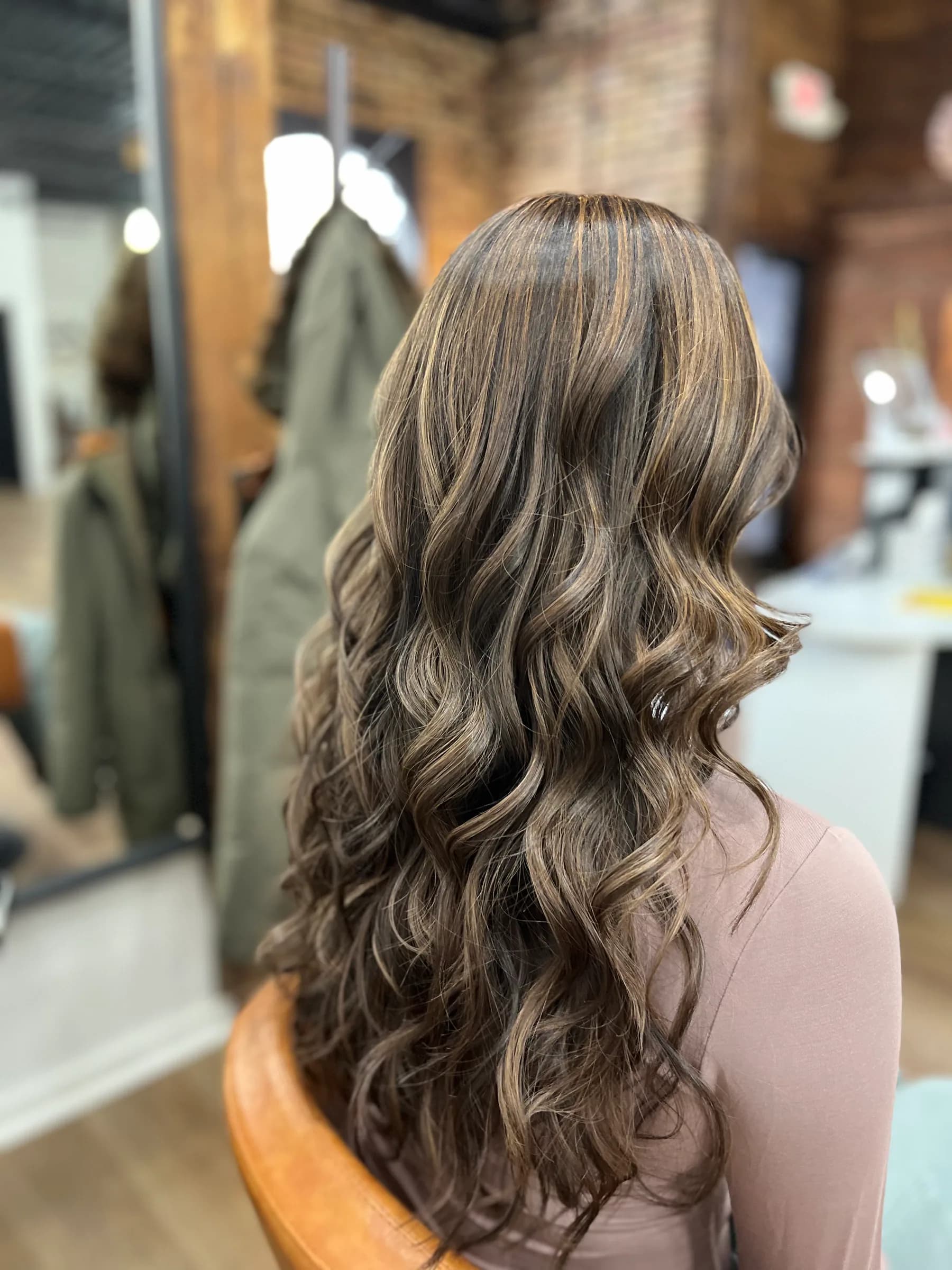 Long brunette hair with subtle dimension and waves