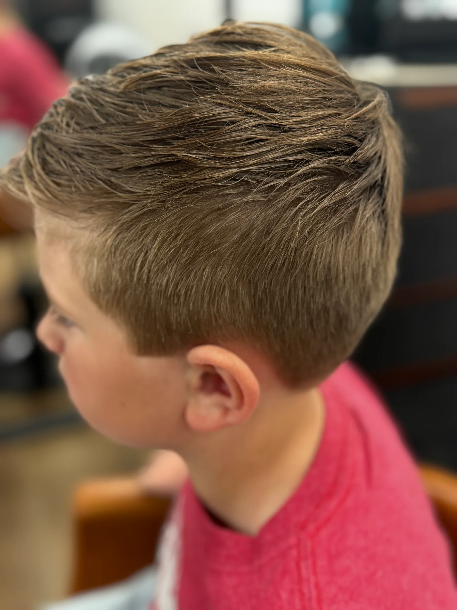 Neat children’s haircut with a tapered side