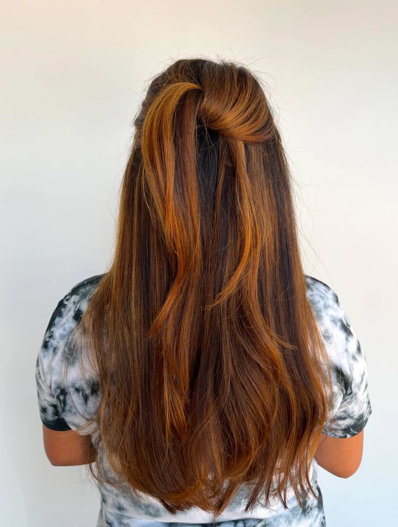 Long brunette hair with vivid copper ribbons