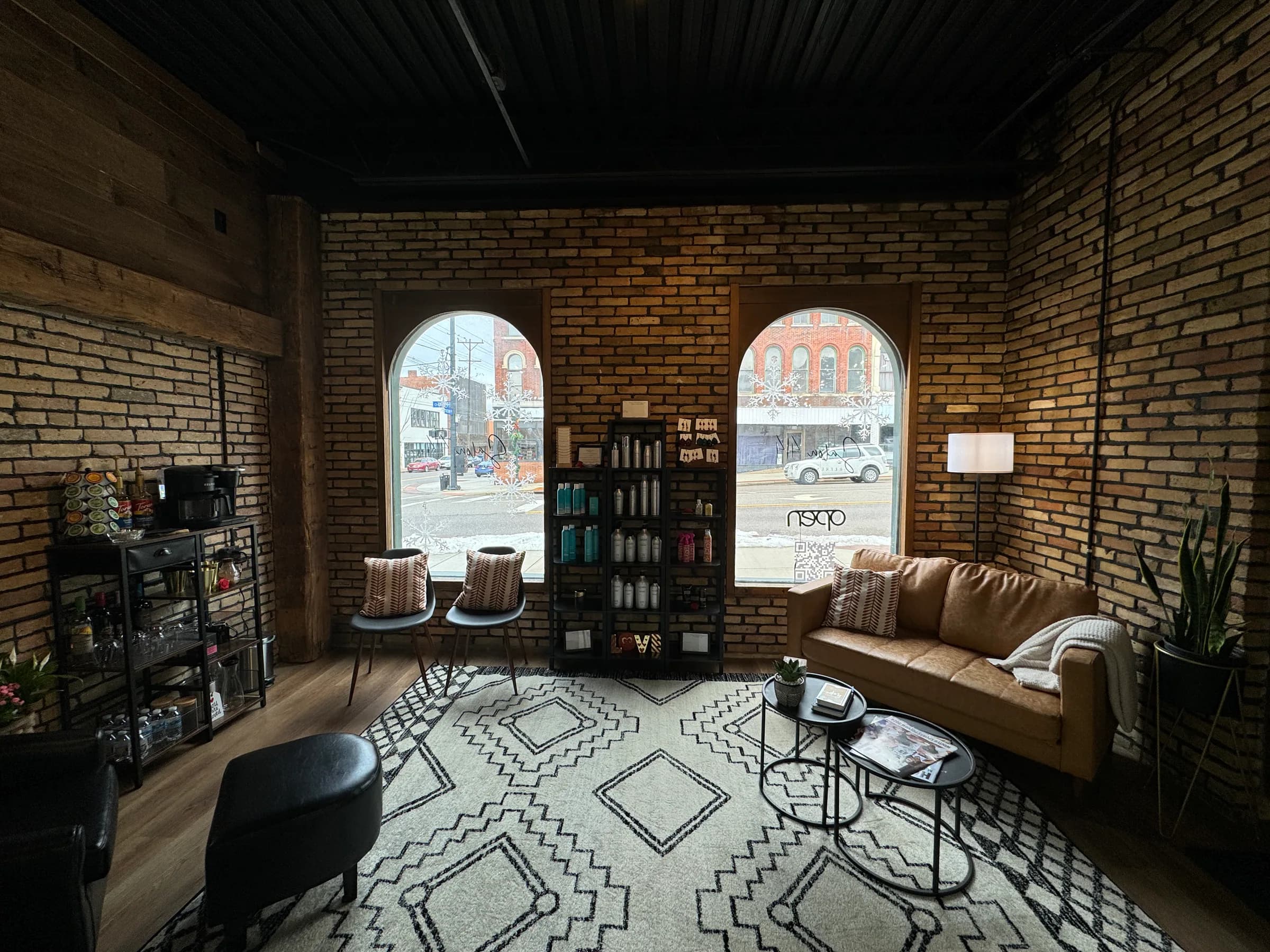 Salon 414 lounge with warm brick walls