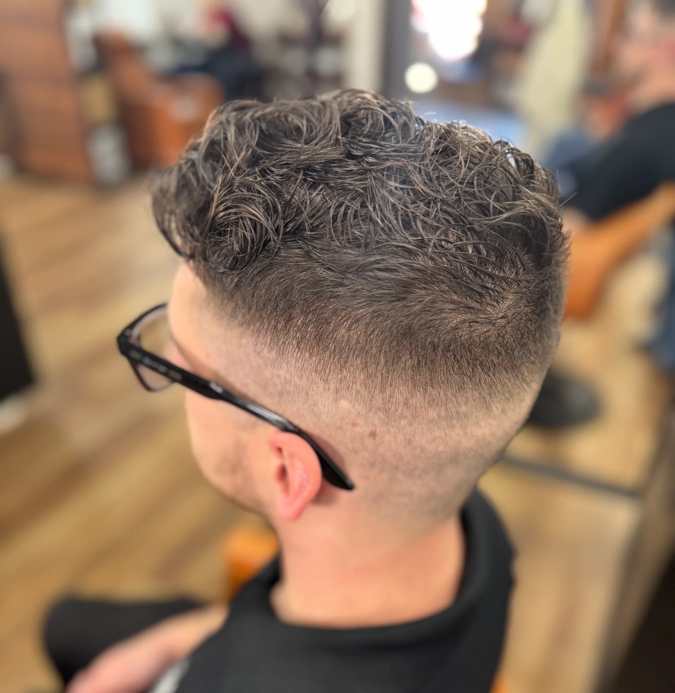 Textured men’s cut with a clean fade